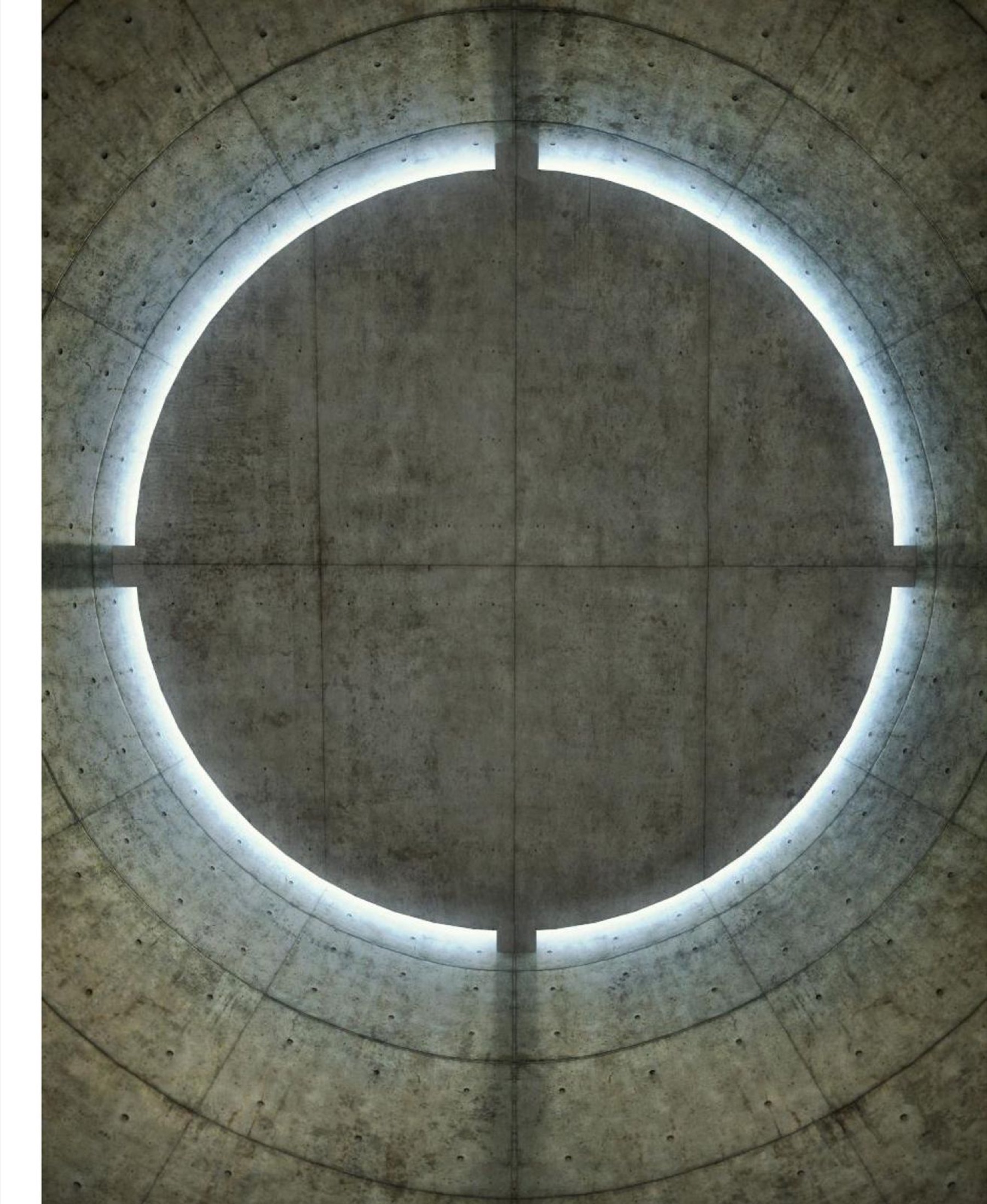 Circular ceiling opening washing a concrete wall with light